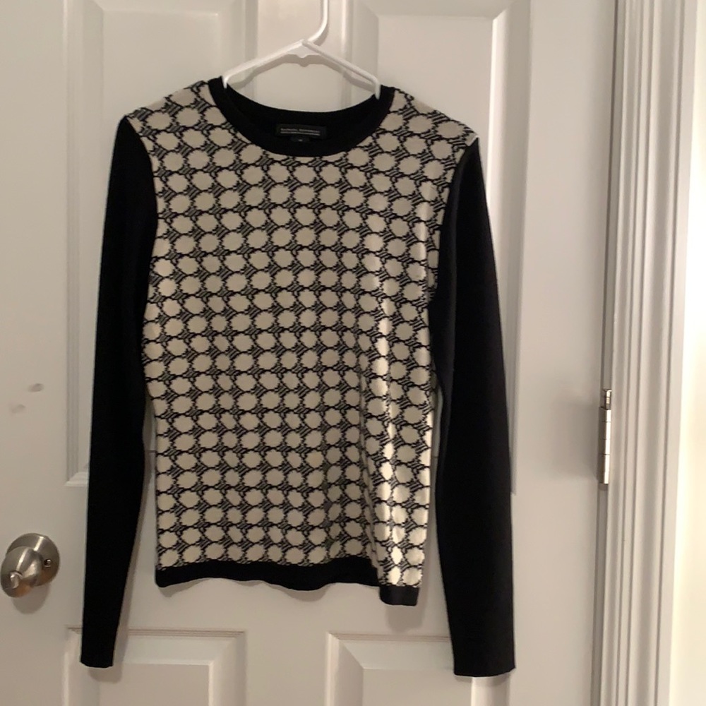 Black and cream colored long sleeve